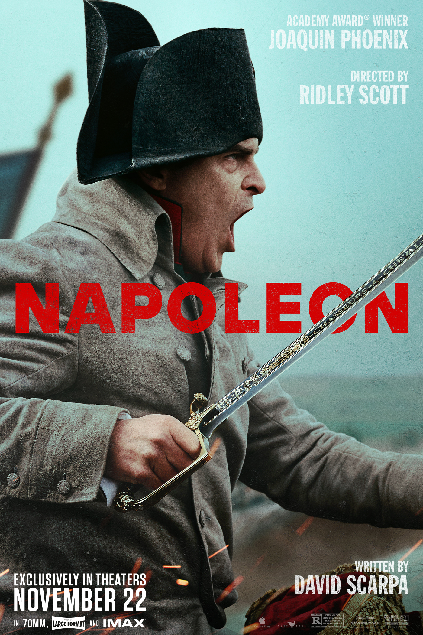 An profile image of Joaquin Phoenix, as Napoleon Bonaparte, charging forward with a sabre in hand. His face is fierce and focused as he appears to be yelling.